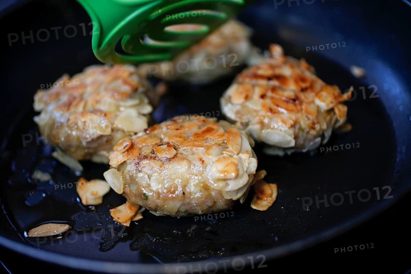 Swabian cuisine, meatballs wrapped in almonds, mixed minced meat, frying meatballs in fat, pan, meatballs, grandmother's cooking, regional, home cooking, typical Swabian, traditional cuisine reinterpreted, spatula, food photography, studio, Germany, Europe