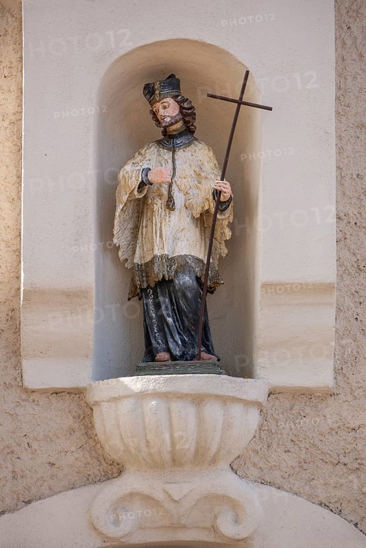 Sculpture of St Nepomuk in a niche on a residential building, Simmelsdorf, Middle Franconia, Bavaria Germany