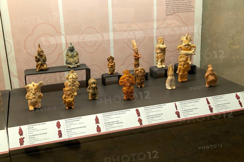 Display case of ceramic figurines from Jaina, Late Classic Period, Mayan archaeological museum, Fort San Jose, Campeche, Mexico, Central America