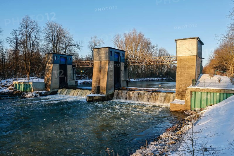 Lünen, North Rhine-Westphalia, Germany - Sunny winter landscape in the Ruhr area, Westfalia weir at sunset with ice and snow on the river Lippe