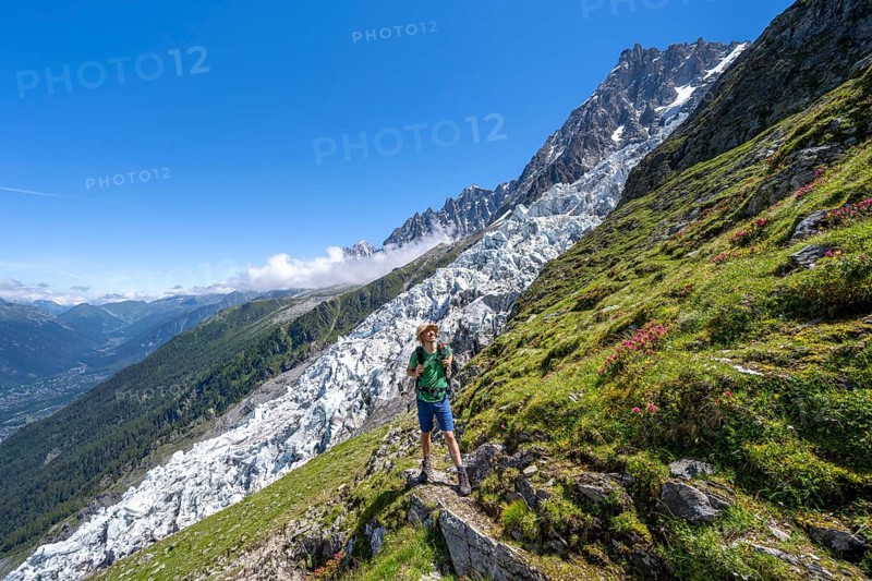 Hiking on the trail to La Jonction, Glacier des Bossons, behind the summit of the Aiguille du Midi, Chamonix, Haute-Savoie, France, Europe