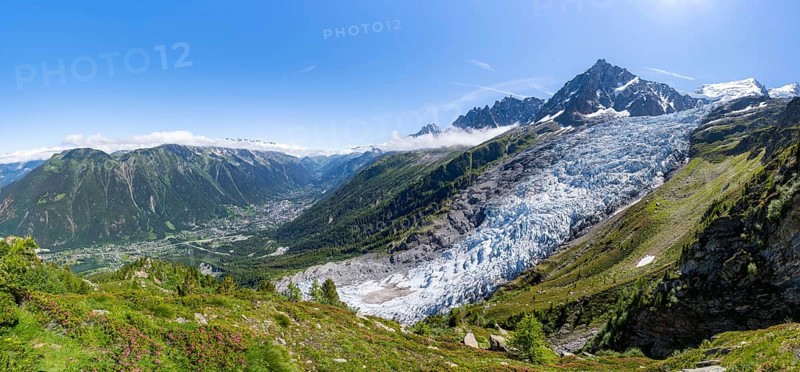Panorama, mountain landscape with glacier Glacier des Bossons and summit of the Aiguille du Midi, view into the valley with the village of Chamonix, Chamonix, Haute-Savoie, France, Europe
