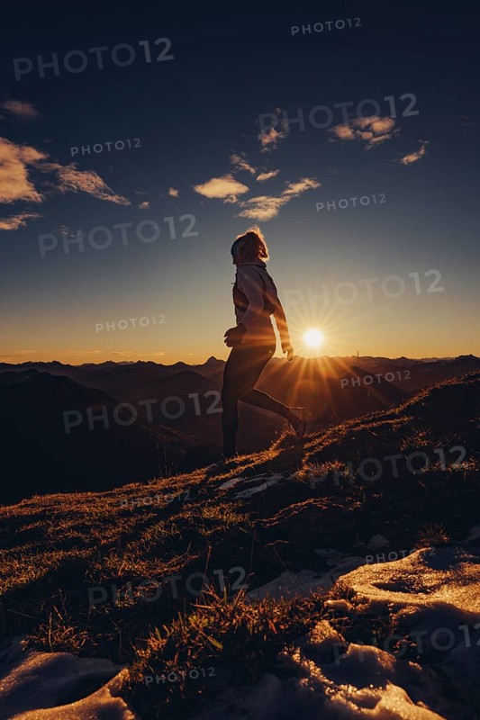 Trail running in autumn on the Jochberg on Lake Walchensee against the wonderful backdrop of the Alps, Bavaria, Germany, Europe