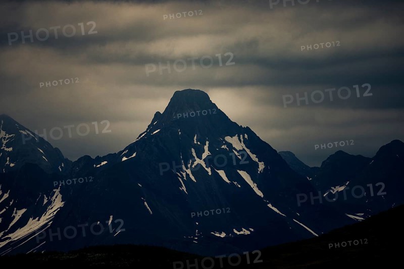 Summit of the Biberkopf in the morning light with dramatic clouds, Lech, Lechquellengebirge, Vorarlberg, Austria, Europe