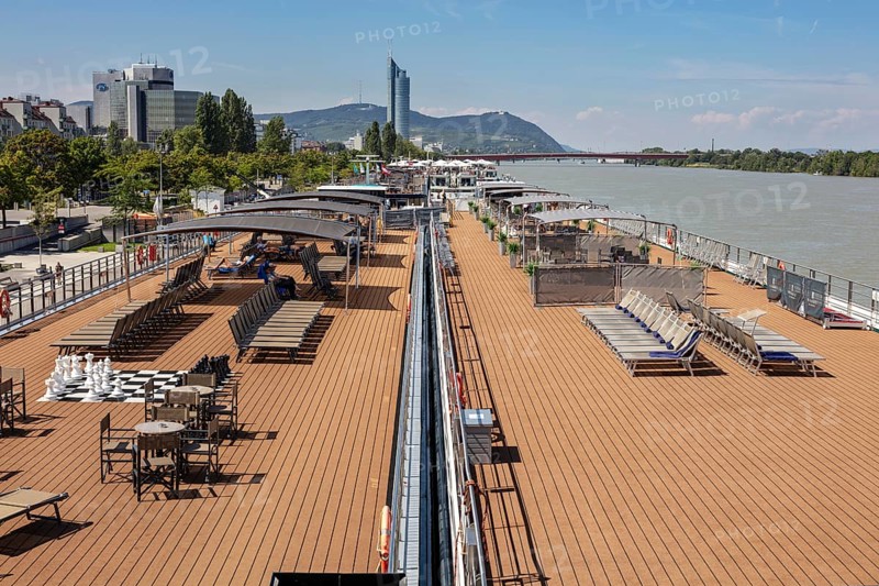Lounge deck on the riverbank with a view of the city, Vienna