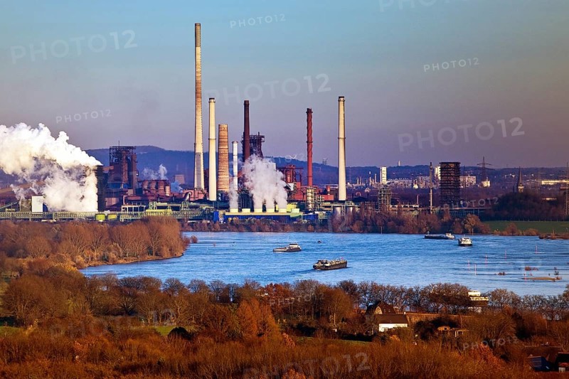 View from the Rheinpreussen spoil tip to Duisburg with ships on the Rhine and the Thyssen Krupp plant in Bruckhausen, Ruhr area, Germany, Europe