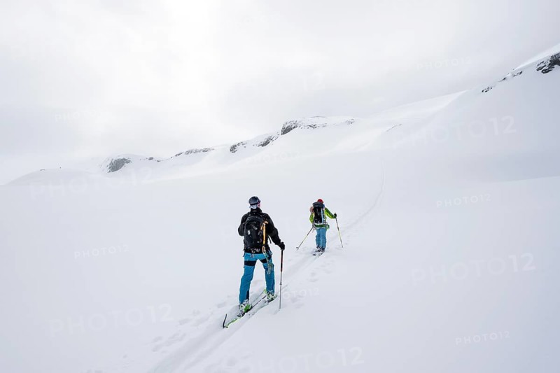 Ski tourer in the fog on the glacier Glacier de la Plaine Morte, mountain landscape with snow, Bernese Alps, Switzerland, Europe
