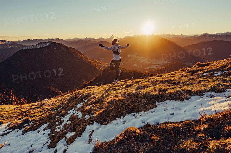 Trail running in autumn on the Jochberg on Lake Walchensee against the wonderful backdrop of the Alps, Bavaria, Germany, Europe