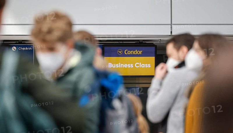 Düsseldorf, North Rhine-Westphalia, Germany - Düsseldorf Airport, Easter holidaymakers at the Condor check-in counter in times of the corona pandemic on their way to Majorca, in front of the flight to Spain and also in front of the return flight to Germany, air travellers must present a negative corona test