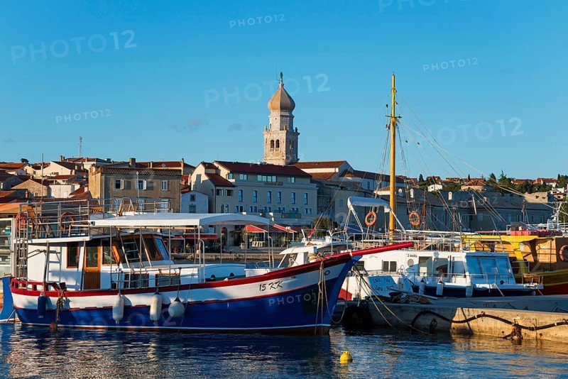 A harbour full of boats and ships with a striking bell tower in the background under a sunny sky, old town, Krk town with St. Mary's basilica, Krk island, Kvarner Gulf Bay, Primorje-Gorski kotar, Croatia, Europe