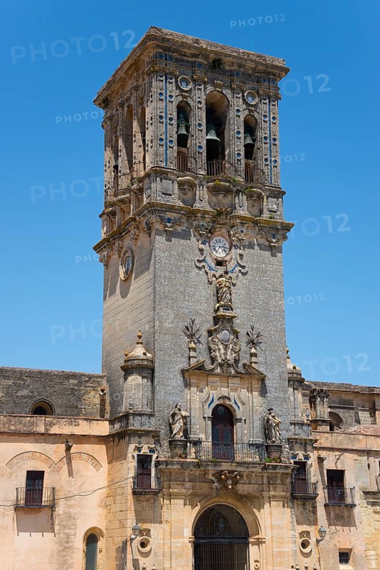 Historic bell tower with intricate sculptures, a clock and detailed stonework, Basilica Santa María de la Asunción, Church of Santa Maria de la Asuncion, Arcos de la Frontera, Cádiz province, Cadiz, Andalusia, Spain, Europe