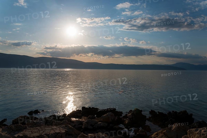 Sunny sky over a calm sea with reflecting sunlight, Glavotok, island of Krk, Primorje-Gorski kotar, Croatia, Europe