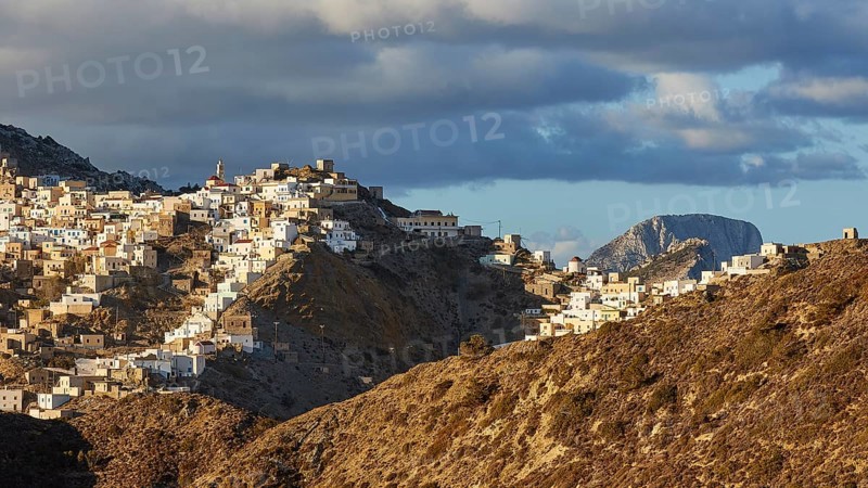 An elongated village under a bright sky with scattered clouds, situated on a hill, Colourful mountain village, Morning light, Olymbos, Karpathos, Dodecanese, Greek Islands, Greece, Europe