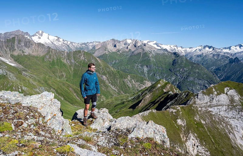 Mountaineer in front of mountain panorama with Großvenediger, mountain landscape with mountain peaks of the Venediger group, view from the summit of the Gösleswand, Lasörling group, Hohe Tauern National Park, East Tyrol, Tyrol, Austria, Europe
