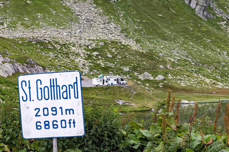 Gotthard Pass. Pass summit with sign and caravan park. Airolo, Canton Ticino, Switzerland, Europe