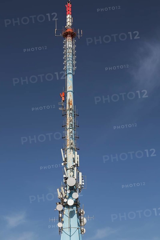 Mobile phone communications tower with antennas against blue sky, Mount Srd, Dubrovnik, Croatia, Europe