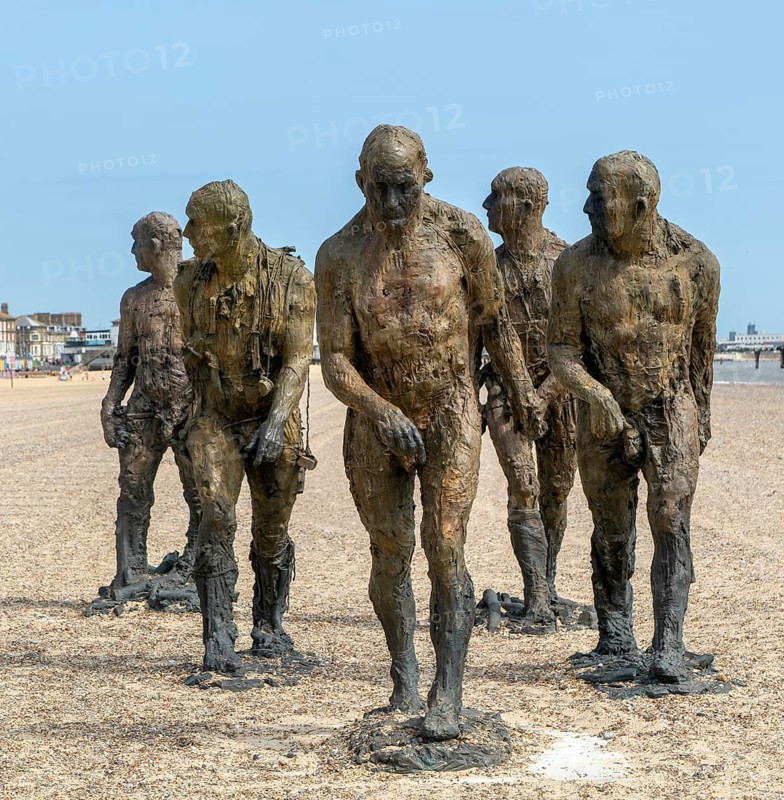 'Walking Men' artwork bronze sculptures by Laurence Edwards, South Beach, Lowestoft, Suffolk, England, UK July 2024