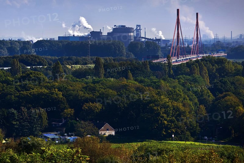 View from the Rheinpreussen spoil tip in Moers to the ThyssenKrupp plant with the bridge of the A 42 motorway in Duisburg, Ruhr area, North Rhine-Westphalia, Germany, Europe