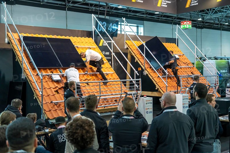 Presentation of the rapid installation of a solar system on a residential house with a pitched roof, in the form of a competition, European Solar Games, at the Solar Solutions Düsseldorf trade fair, over 250 international exhibitors present products and services from the solar industry, smart storage, EV charging and green HVAC to a trade audience of users and dealers, Düsseldorf, North Rhine-Westphalia, Germany, Europe