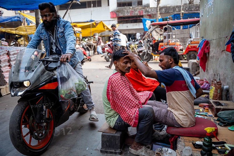 People gets a haircut at the street, on the day of the presentation of Union Budget, in Guwahati, India on 1 February 2025. Finance Minister Nirmala Sitharaman presented the Union Budget 2025-26 in the parliament today