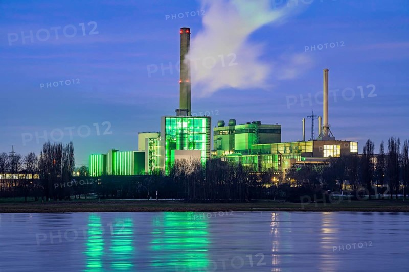 The Lausward combined heat and power plant in Düsseldorf, gas and steam turbine power plant, operated by Stadtwerke Düsseldorf and EnBW, on the Rhine, green illuminated city window, the chimney of the Fortuna power plant unit, the power plant generates electricity, also traction current and district heating, North Rhine-Westphalia, Germany, Europe