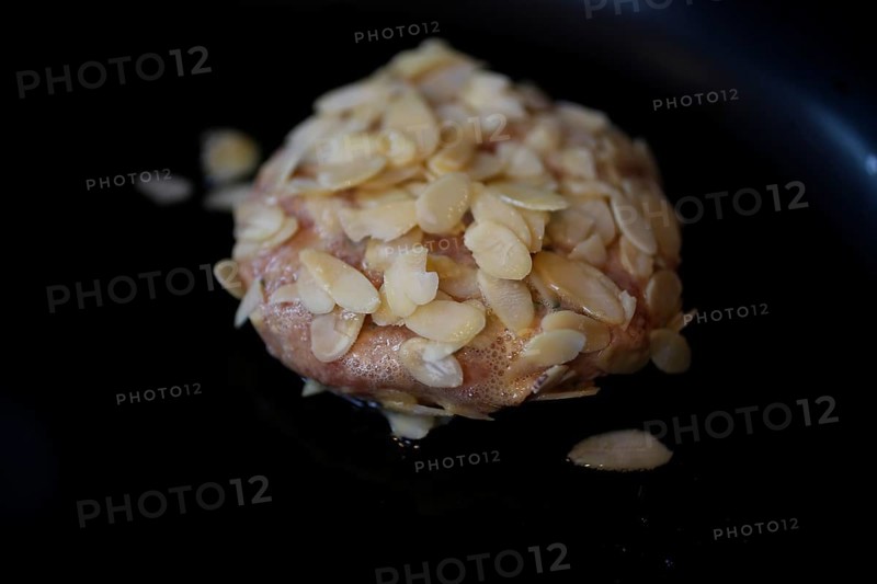 Swabian cuisine, meatballs wrapped in almonds, mixed minced meat, raw, frying meatballs in fat, frying pan, meatballs, grandmother's cooking, regional, home cooking, typical Swabian, traditional cuisine reinterpreted, food photography, studio, Germany, Europe
