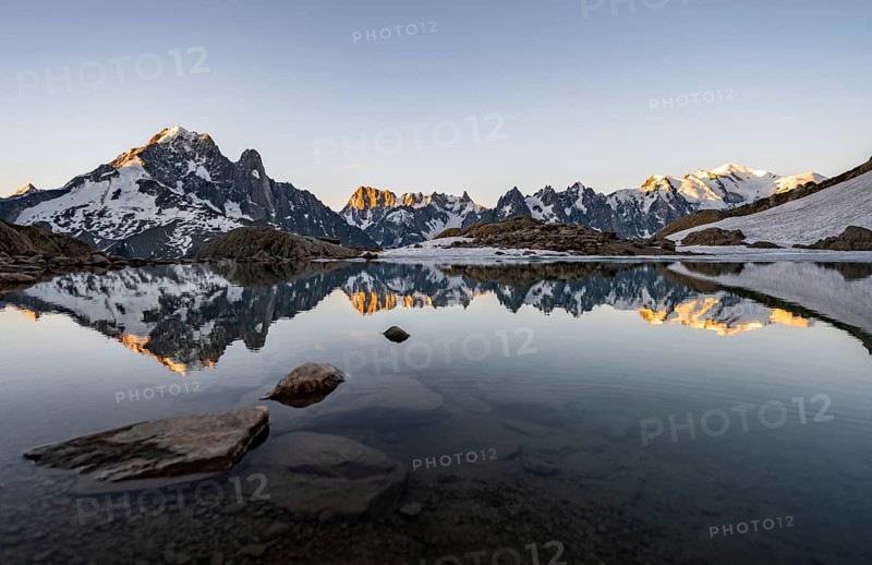 Morning atmosphere at a mountain lake, mountain landscape at sunrise, water reflection in Lac Blanc, mountain peak, Aiguille Verte, Grandes Jorasses, Aiguille du Moine, Mont Blanc, Mont Blanc massif, Chamonix-Mont-Blanc, Haute-Savoie, France, Europe
