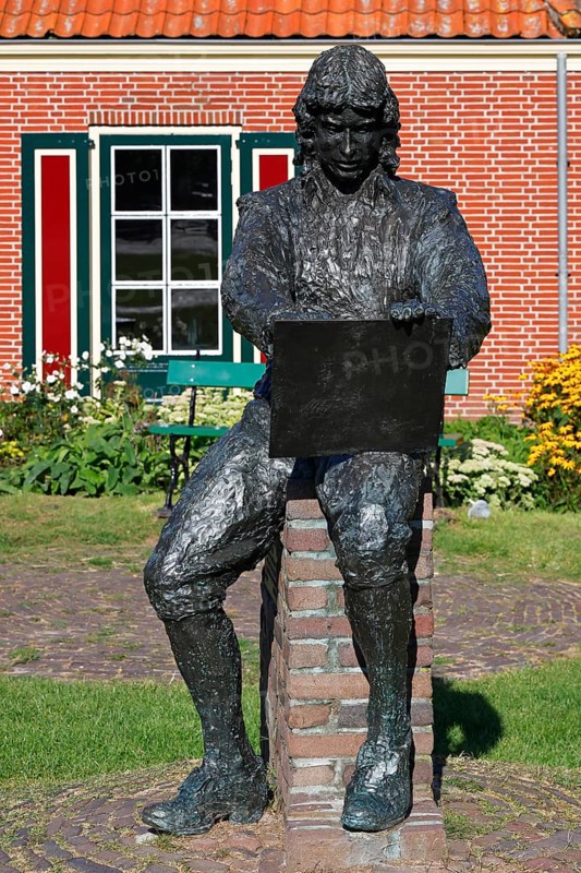 Bronze sculpture showing Paulus Potter, the painter holding a sketchpad, statue by Jan van Velzen, Enkhuizen, North Holland, Netherlands