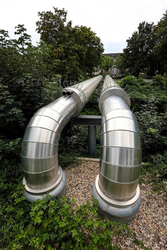 Essen, North Rhine-Westphalia, Germany, district heating pipeline in the Rüttenscheid district. The Osttrasse project crosses railway tracks above ground here. STEAG supplies around 190, 000 households in Essen with district heating. Two thirds of the energy comes from waste-to-energy plants, one third comes from the coal-fired power plant in Herne, Europe