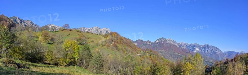 Autumn colours with a view towards the mountain range with Refugio Achille Papa, Piccolo Dolomiti, Recoaro Terme, Province of Vicenza, Italy, Europe