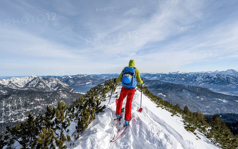 Ski tourer at the summit of Simetsberg, mountain panorama, Estergebirge, Bavarian Prealps, Bavaria Germany