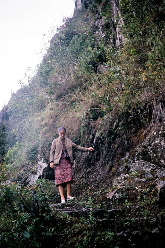 Female tourist descending the steep mountain path Huayna Picchu, Machu Picchu, Peru, South America around 1962, South America