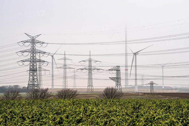 Wind farm in the fog, high-voltage pylons, dark doldrums, no wind no direct sunlight, in the Rhenish lignite mining area, south of Rommerskirchen North Rhine-Westphalia, Germany, Europe