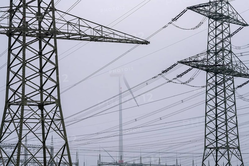 Wind farm in the fog, high-voltage pylons, dark doldrums, no wind no direct sunlight, in the Rhenish lignite mining area, south of Rommerskirchen North Rhine-Westphalia, Germany, Europe