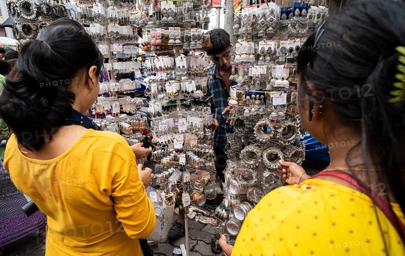 Women buys jewelleries at street market ahead of Durga Puja festival on October 7, 2024 in Guwahati, India. Shopping ahead of Durga Puja is a major event, as people prepare for the celebration