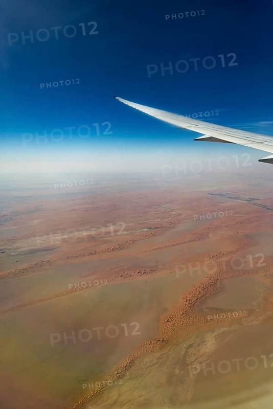 Landing approach over the desert to Abu Dhabi with the airline Etihad. View from the window of a Boeing 787 aircraft. Abu Dhabi, United Arab Emirates, UAE, Southwest Asia, Asia