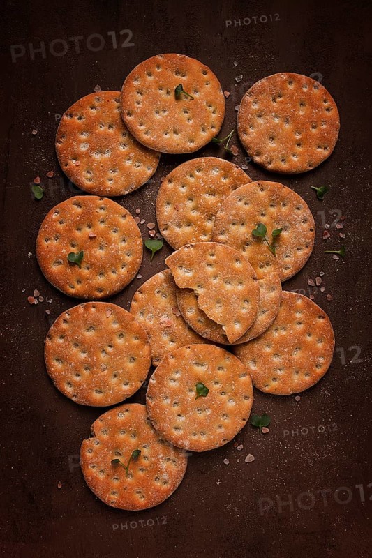 Crispbread, round, with salt and herbs, top view, food concept, no people