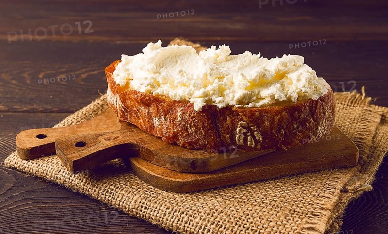 Sandwich, with cream cheese, homemade, on a cutting board, rustic style, no people, selective focus, breakfast