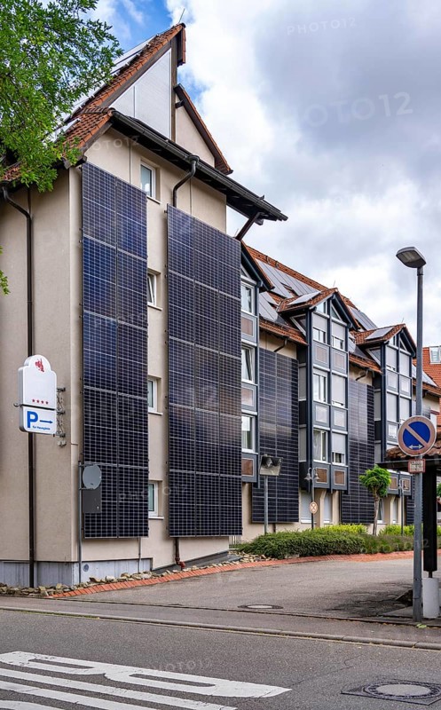 Solar façade, photovoltaic elements on a building façade, hotel in Herrenberg, large PV modules generate electricity on the outer walls of the building, Herrenberg, Baden-Württemberg, Germany, Europe