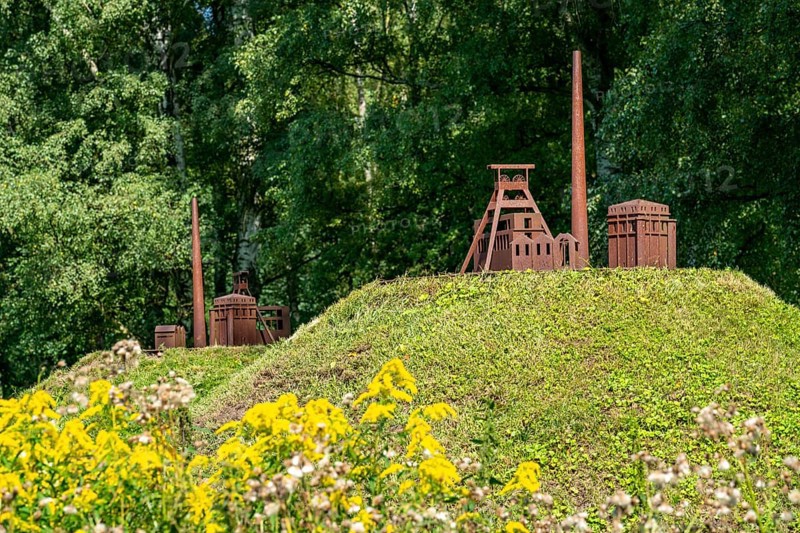 Art axis Burgenland, artwork by artist Nils-Udo, for the Ruhr.2010 Capital of Culture, 15 green hills, 8 of them with models made of Corten steel, of the pithead and Malakow tower of the Ewald colliery, on a 2 kilometre long path from Herten Castle Park to the Hoheward slag heap landscape, North Rhine-Westphalia, Germany, Europe