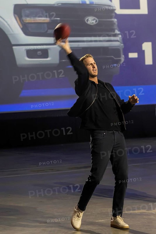 Detroit, Michigan USA - 9 January 2025 - Ford Vehicles are displayed at the 2025 Detroit Auto Show. Detroit Lions quarterback Jared Goff showed up to promote the cars. (The Detroit Lions team is owned by Sheila Ford Hamp, a descendant of the Ford family.)