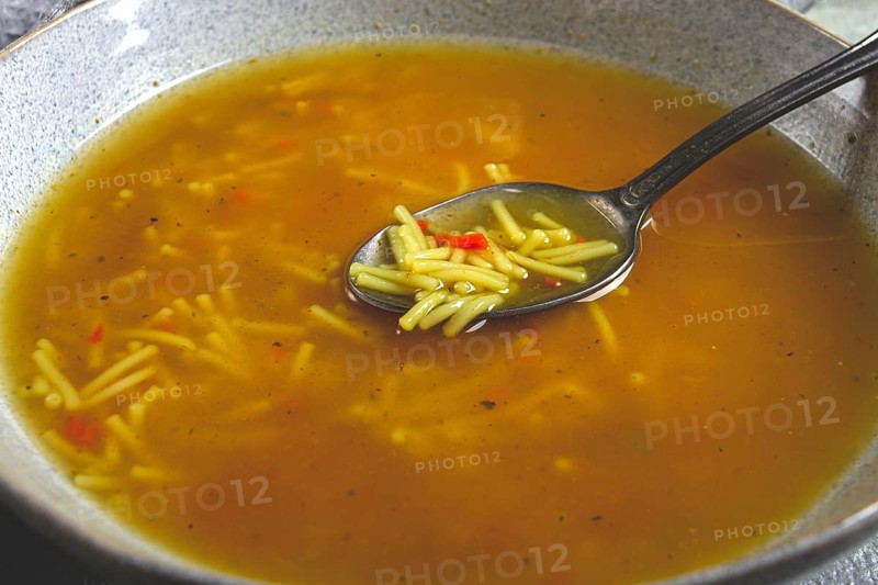 Chicken soup with noodles, homemade, no people, close-up