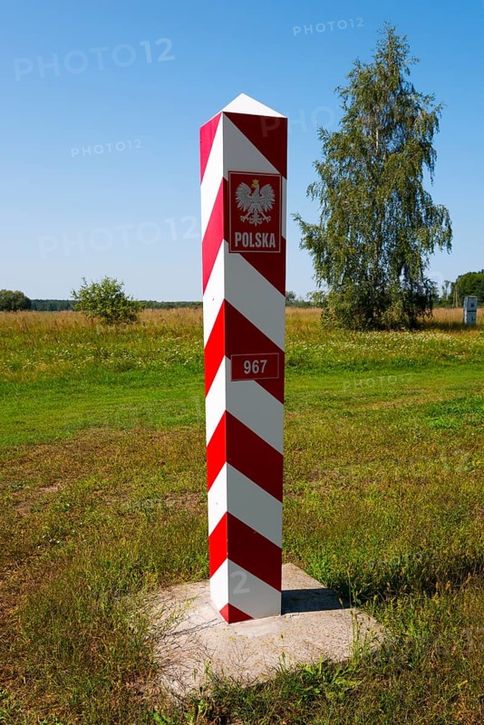 Polish red and white border post on a green meadow under a sunny sky, border with Ukraine, Bereznica, Bereznica, Dorohusk, Horodlo, Horodlo, Hrubieszowski Voivodeship, Lublin Voivodeship, Poland, Europe