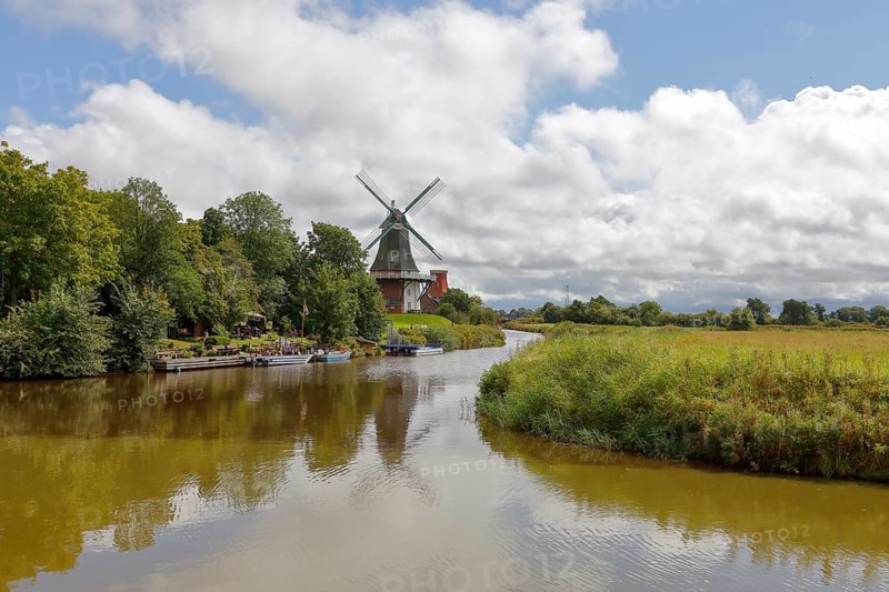 The Green Mill, one of Greetsiel's twin mills on the Old Greetsiel Sieltief, Greetsiel, Krummhörn, East Frisia, Lower Saxony, Germany, Europe
