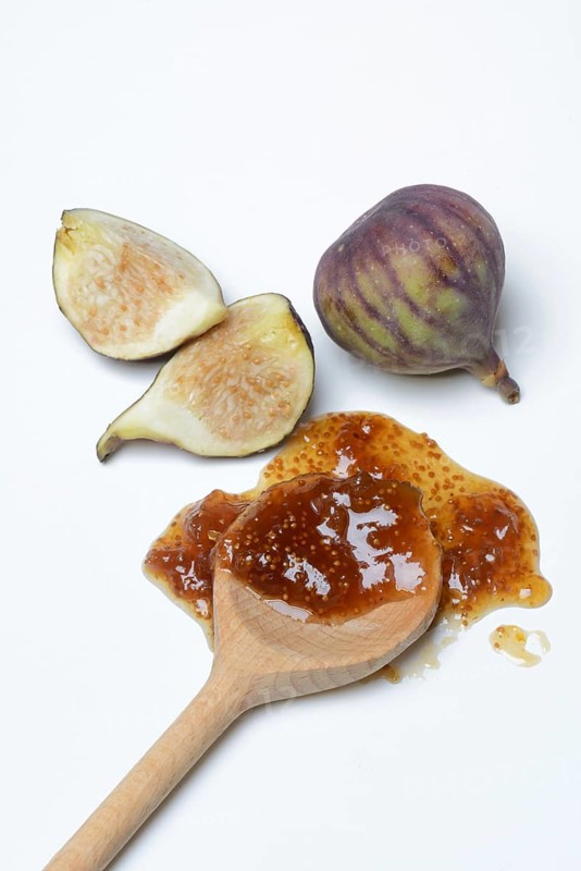 Fig jam in cooking spoon and fresh figs, Ficus carica