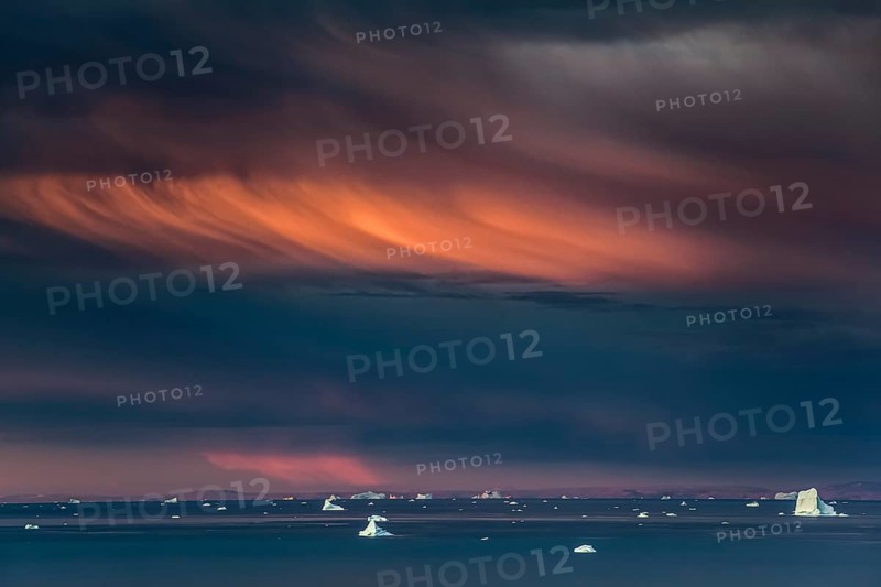 Evening light and atmosphere in fjord with icebergs, cloudy, autumn, Scoresby Sund, East Greenland, Greenland, North America