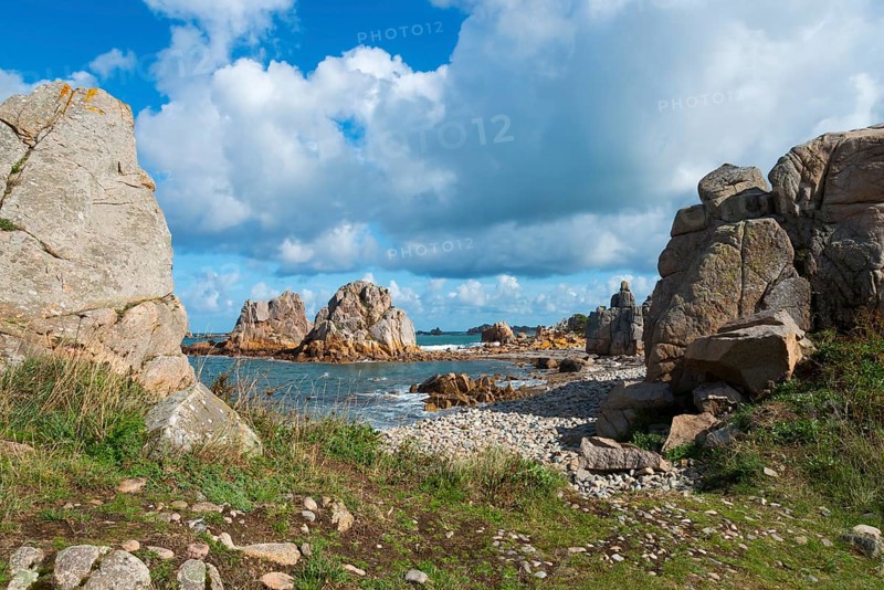 Coastal landscape with rocks, sea view and grassy paths under a cloudy sky, Plage de Pors Scaff, Plougrescant, Côtes-d'Armor, English Channel, Brittany, France, Europe