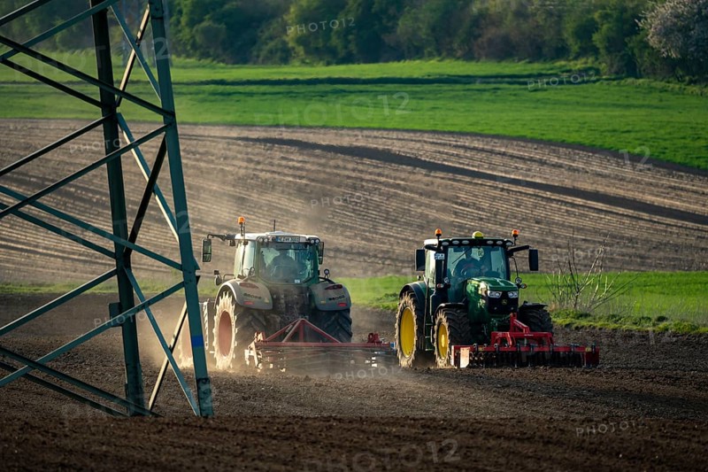 Tractor working a field near Grevenbroich, in spring, Germany, Europe