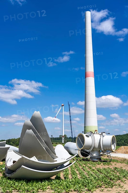 Repowering of a wind farm, near Brilon-Radlinghausen, 2 old turbines are demolished, rotors and dome are already on the ground and 4 new wind turbines are erected, each with a hub height of 160 metres, each with an output of 4.2 MW, North Rhine-Westphalia, Germany, Europe