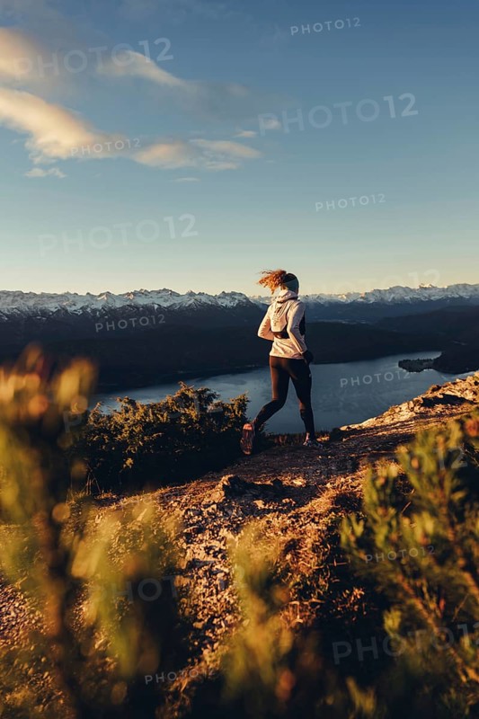 Trail running in autumn on the Jochberg on Lake Walchensee against the wonderful backdrop of the Alps, Bavaria, Germany, Europe